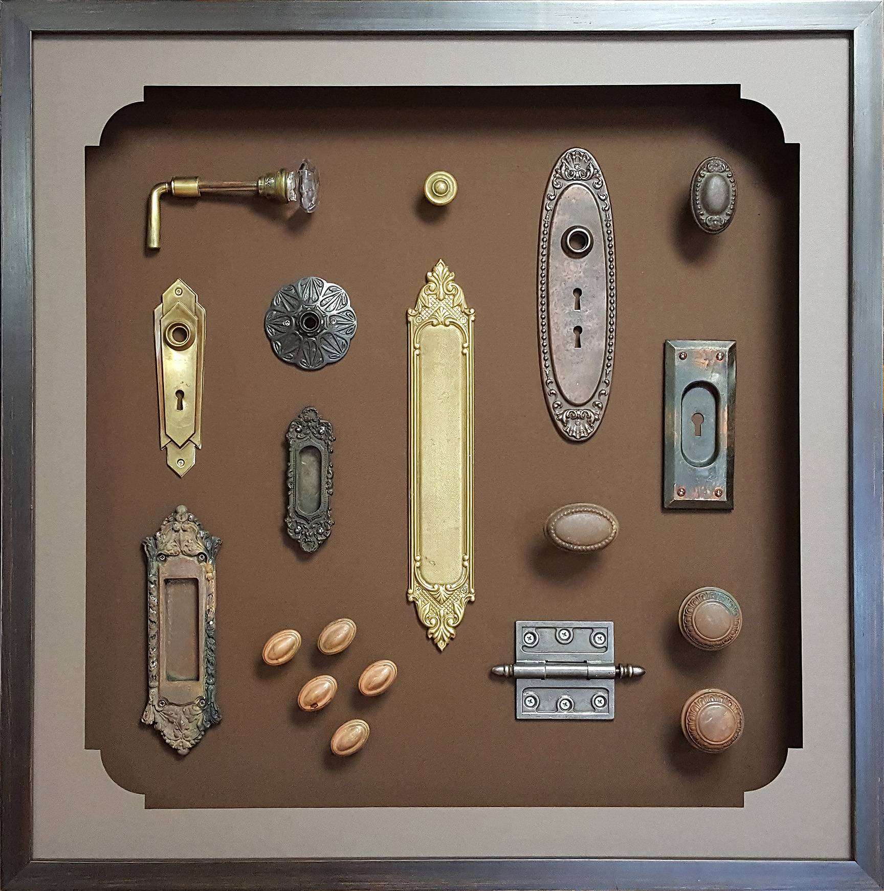 A shadow box with a vintage hardware